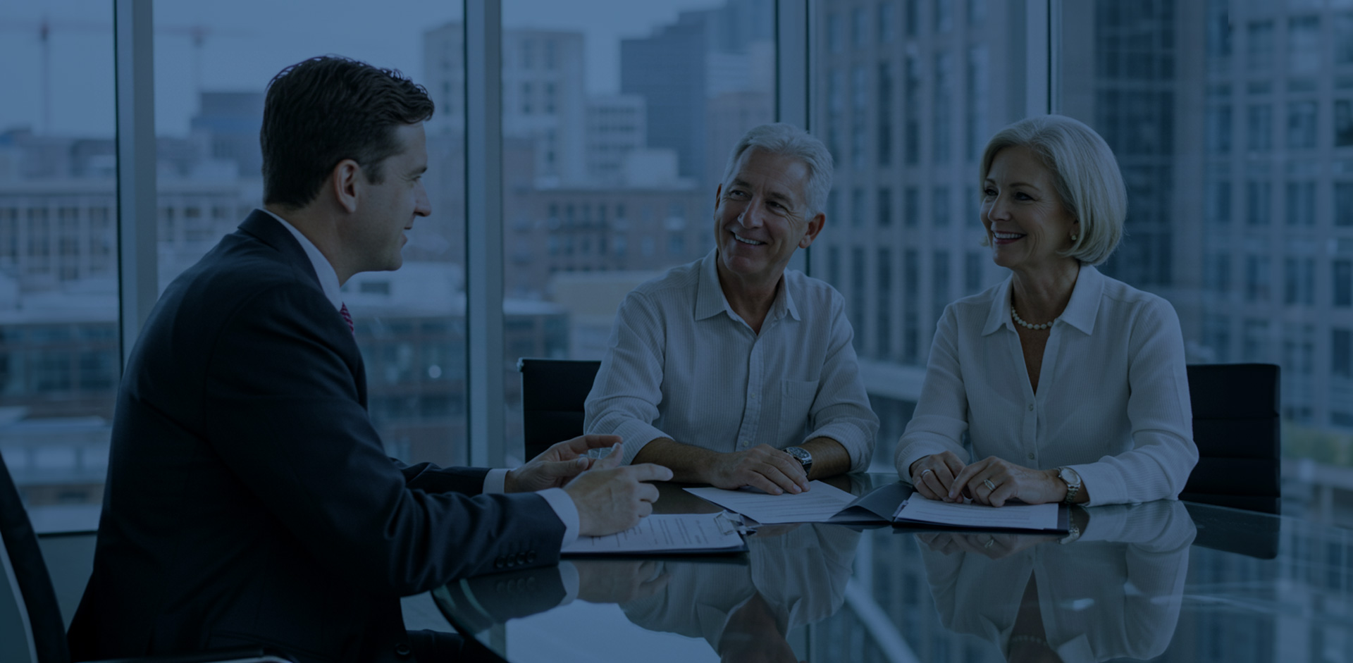 An advisor talking to clients in his office